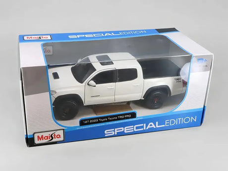 Maisto 1:27 Toyota Tacoma TRD 2023 Gris/Blanco 32910